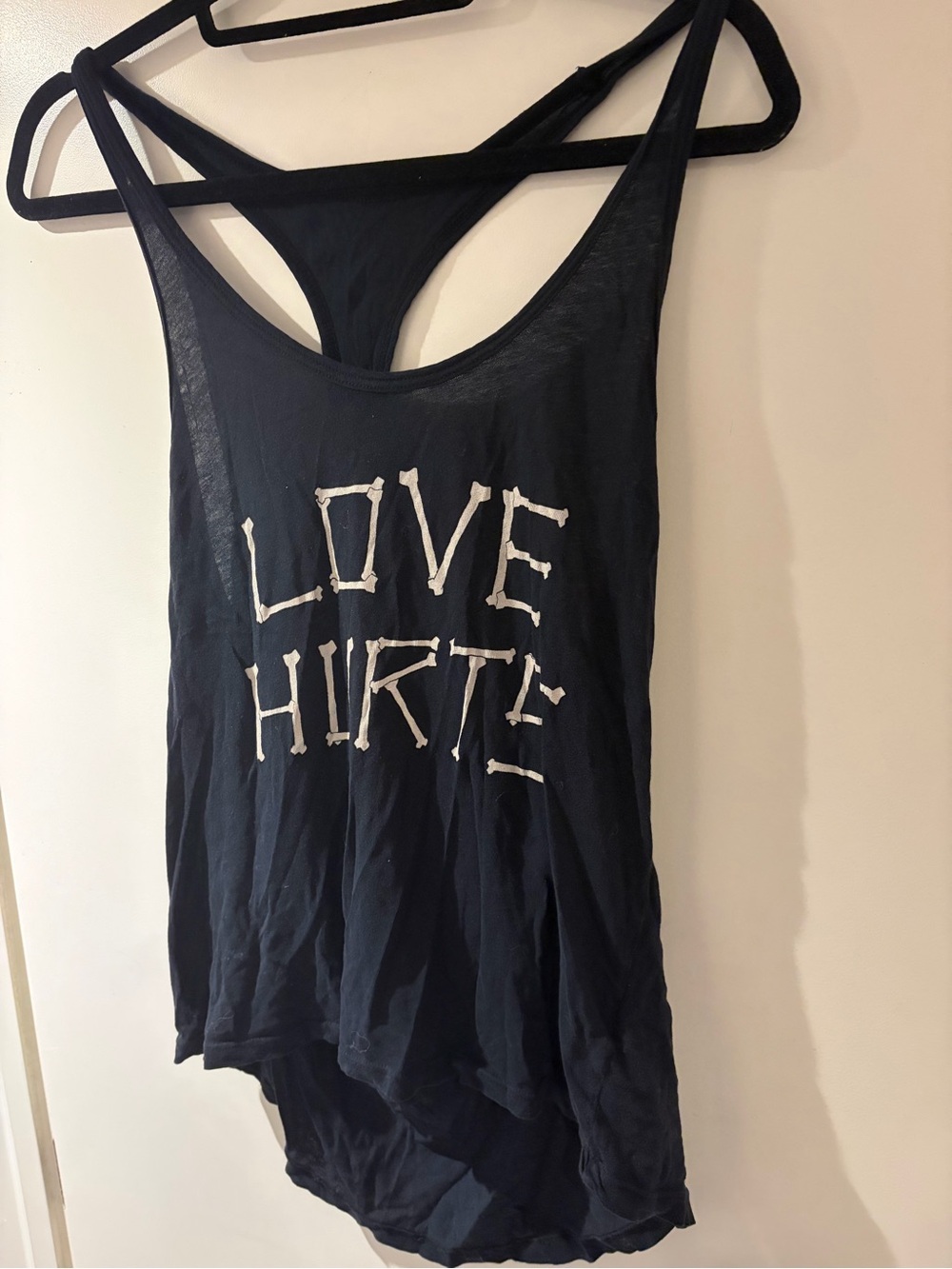 Womenâs Black Graphic Racerback Tank Top - LOVE HURTS